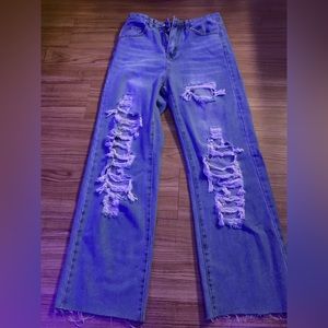 flared ripped light blue jeans